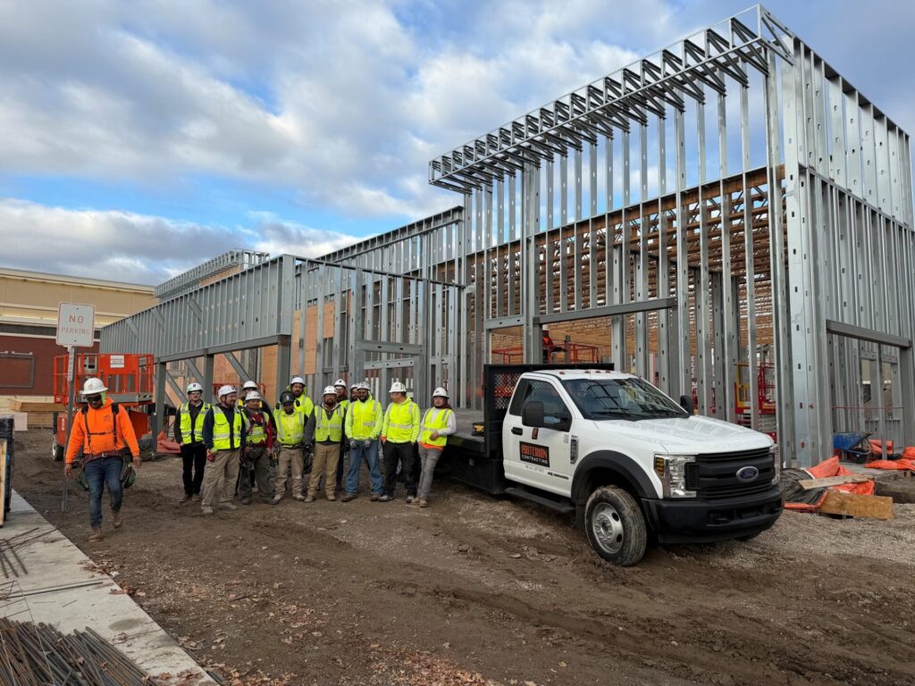 Criterion Contracting crew in front of Yard House metal stud framing